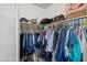 Walk-in closet provides ample storage with rods, shelves, and accessories, great for organizing wardrobe at 17 W Vernon Ave # 31, Phoenix, AZ 85003