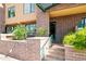 Brick condo exterior with green trim, landscaping, and a welcoming entrance at 17 W Vernon Ave # 31, Phoenix, AZ 85003