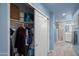 Hallway features tile flooring and leads to a bathroom with a walk-in shower at 17 W Vernon Ave # 31, Phoenix, AZ 85003