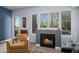 This living room boasts a cozy fireplace, large windows, and comfortable seating area at 17 W Vernon Ave # 31, Phoenix, AZ 85003