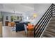 Bright and spacious living room with hardwood floors, fireplace and stairs to 2nd story at 17 W Vernon Ave # 31, Phoenix, AZ 85003