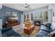 Cozy living room with fireplace, neutral paint, wood floors and plenty of light at 17 W Vernon Ave # 31, Phoenix, AZ 85003