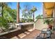 Brick patio with comfortable seating and mature trees at 17 W Vernon Ave # 31, Phoenix, AZ 85003