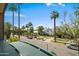 From the balcony is a view of the street with palm trees and various cars at 17 W Vernon Ave # 31, Phoenix, AZ 85003