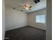 Carpeted bedroom with natural light and a ceiling fan at 1725 W Pollack St, Phoenix, AZ 85041