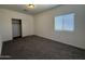 Bedroom featuring neutral carpet, window and closet at 1725 W Pollack St, Phoenix, AZ 85041
