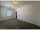 Carpeted bedroom with natural light and a view to the hall at 1725 W Pollack St, Phoenix, AZ 85041