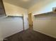 Walk-in closet with ample shelving, carpet, and access to other rooms at 1725 W Pollack St, Phoenix, AZ 85041