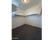 Walk-in closet with carpet flooring and shelving, perfect for organization and storage at 1725 W Pollack St, Phoenix, AZ 85041