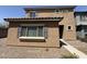 Tan two-story home showing front entrance and landscaped ground cover at 1725 W Pollack St, Phoenix, AZ 85041