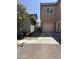 Side exterior view of garage and walkway with partial view of neighboring home at 1725 W Pollack St, Phoenix, AZ 85041
