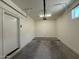 Bright two-car garage featuring an automatic door and access door, with windows for added light at 1725 W Pollack St, Phoenix, AZ 85041