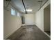 Clean garage with a water heater and overhead lighting, providing ample space for storage at 1725 W Pollack St, Phoenix, AZ 85041