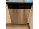 Stainless steel Whirlpool dishwasher set in white cabinets under black countertop at 1725 W Pollack St, Phoenix, AZ 85041