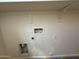 Laundry room water and dryer hookups and shelving at 1725 W Pollack St, Phoenix, AZ 85041