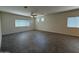 Spacious living room with tile floors, neutral paint, and several windows at 1725 W Pollack St, Phoenix, AZ 85041