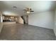 Bright living room with tile flooring, ceiling fan, and staircase to upper level at 1725 W Pollack St, Phoenix, AZ 85041