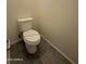 Close-up of a clean, standard toilet in a neutral-toned bathroom with tiled floors at 1725 W Pollack St, Phoenix, AZ 85041
