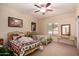 Nice-sized bedroom featuring two beds, neutral carpeting, and a ceiling fan at 1802 W Encinas St, Gilbert, AZ 85233