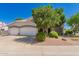 Charming home featuring a spacious three-car garage and mature landscaping, offering great curb appeal at 1802 W Encinas St, Gilbert, AZ 85233