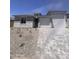 Charming single-Gathering home featuring a three-car garage, stone accents, and a well-manicured front yard at 18676 E Helian Dr, Gold Canyon, AZ 85118