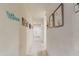 Bright hallway featuring neutral walls, tiled floors, and tasteful decor, creating an inviting atmosphere at 18711 W Farmer Rd Rd, Buckeye, AZ 85326