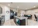 Open-concept kitchen featuring granite countertops, stainless appliances, and seamless access to dining area at 18711 W Farmer Rd Rd, Buckeye, AZ 85326