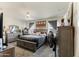 Spacious main bedroom with neutral tones, ceiling fan, dresser and charming rustic decor at 18711 W Farmer Rd Rd, Buckeye, AZ 85326