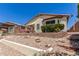 Backyard view with terraced landscaping and exterior of house at 19822 N 108Th Ave, Peoria, AZ 85373