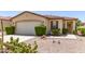 Charming home featuring a two-car garage, desert landscaping and a well maintained yard at 19822 N 108Th Ave, Peoria, AZ 85373