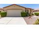 Charming home featuring a two-car garage, desert landscaping and a well maintained yard at 19822 N 108Th Ave, Peoria, AZ 85373