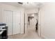 Hallway view with open doors and closet in a well-lit home at 19822 N 108Th Ave, Peoria, AZ 85373