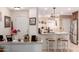 Modern kitchen featuring an open layout, bar seating, and views into the dining area at 19822 N 108Th Ave, Peoria, AZ 85373