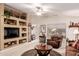 Inviting living room featuring neutral colors, built-in shelving, and a comfortable seating area at 19822 N 108Th Ave, Peoria, AZ 85373