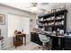 Bright home office with built-in shelves, desk, and a comfortable chair at 19822 N 108Th Ave, Peoria, AZ 85373
