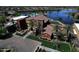 Stunning aerial view of a community clubhouse, pool and lake at 20211 N Winter Escape Ct, Maricopa, AZ 85138