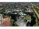 Expansive aerial view of the community featuring lake, clubhouse, pool, and many houses at 20211 N Winter Escape Ct, Maricopa, AZ 85138