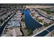 Houses line the water in this aerial view of private backyards and a lake at 20211 N Winter Escape Ct, Maricopa, AZ 85138