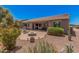 Large backyard featuring a fire pit, desert landscaping, a grill and a covered patio at 20211 N Winter Escape Ct, Maricopa, AZ 85138