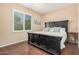 Bedroom with wood floors and large window allowing for plenty of natural light at 20211 N Winter Escape Ct, Maricopa, AZ 85138