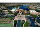 A beautiful clubhouse features a pool, putting greens, and parking in a Primary-planned community at 20211 N Winter Escape Ct, Maricopa, AZ 85138