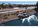 Scenic view of the community with a waterfall feature leading into the lake and well-kept homes at 20211 N Winter Escape Ct, Maricopa, AZ 85138