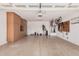 Spacious two-car garage with ample cabinet space and storage solutions at 20211 N Winter Escape Ct, Maricopa, AZ 85138