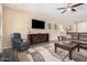 Comfortable living room with a large TV, stylish furniture, and a cozy atmosphere at 20211 N Winter Escape Ct, Maricopa, AZ 85138