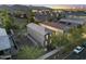 Aerial view of a two-story home with a desert landscape, set within a vibrant community with mountain views at 20872 W Thomas Rd, Buckeye, AZ 85396