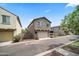 Two-story home with a stucco exterior, and a two-car garage at 20872 W Thomas Rd, Buckeye, AZ 85396