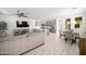 Open-concept living space with a combined kitchen, dining, and living area for modern living at 20872 W Thomas Rd, Buckeye, AZ 85396