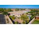 Aerial view of a desert home with a pool and spa, putting green, and well-maintained landscaping at 22323 E Via Del Jardin --, Queen Creek, AZ 85142