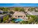 This aerial view features a pool, spa, turf, and patio furniture in the backyard of this single-Gathering home at 22323 E Via Del Jardin --, Queen Creek, AZ 85142