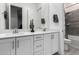 Bathroom featuring double sinks, a large mirror, and modern fixtures providing a clean and stylish space at 22323 E Via Del Jardin --, Queen Creek, AZ 85142